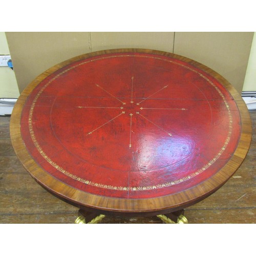 1640 - A regency mahogany centre or library table the circular top inlaid in red gilt tooled leather, raise... 