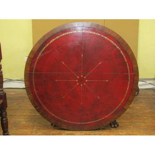 1640 - A regency mahogany centre or library table the circular top inlaid in red gilt tooled leather, raise... 