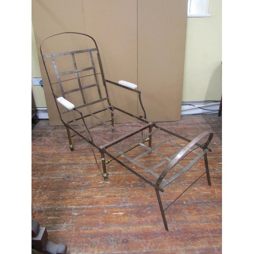 1641 - A 19th century folding campaign chair/bed in brass and steel