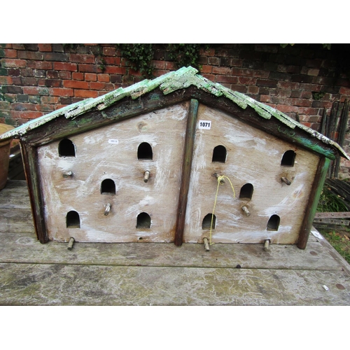 1071 - A rustic wooden wall mount bird house with numerous arched entrances, 49cm high x 90cm wide x 20cm d... 