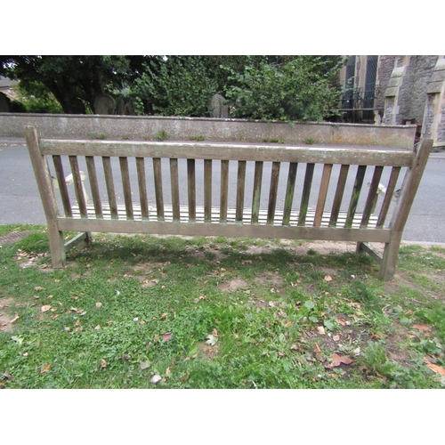 1074 - A substantial weathered teak garden/park bench with slatted seat and back, 248cm (8ft long) x 98cm h... 