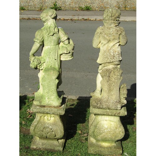 1054 - Three weathered cast composition stone garden ornaments representing three of the four seasons raise... 