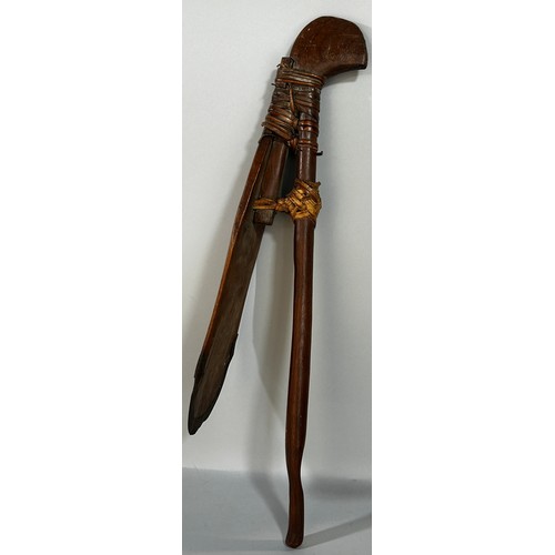 670 - An Sahel Region wooden hoe with an iron clad blade, 64cm long.