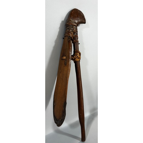 670 - An Sahel Region wooden hoe with an iron clad blade, 64cm long.