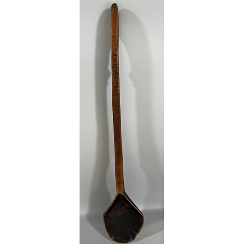 671 - An old hand made wooden spoon, possibly Zulu, from one piece of wood, 69cm long.