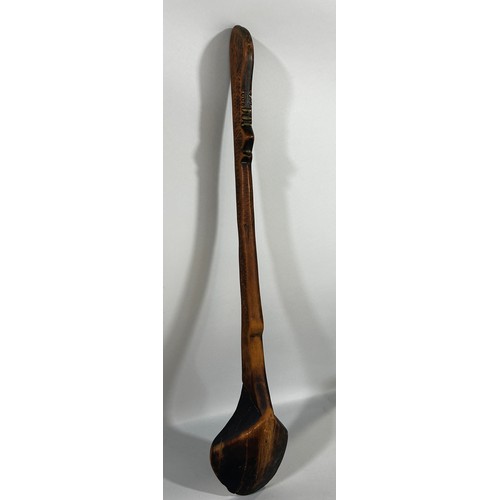 671 - An old hand made wooden spoon, possibly Zulu, from one piece of wood, 69cm long.