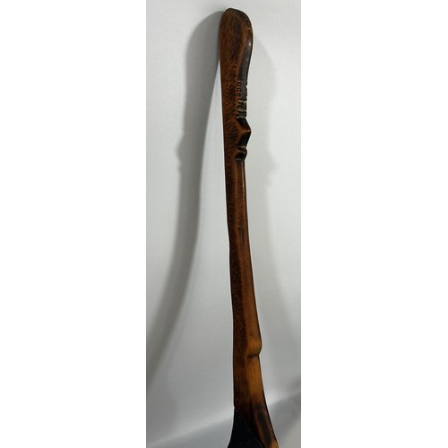 671 - An old hand made wooden spoon, possibly Zulu, from one piece of wood, 69cm long.