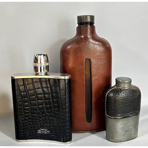 663 - Four various hip flasks in varying shapes and sizes.