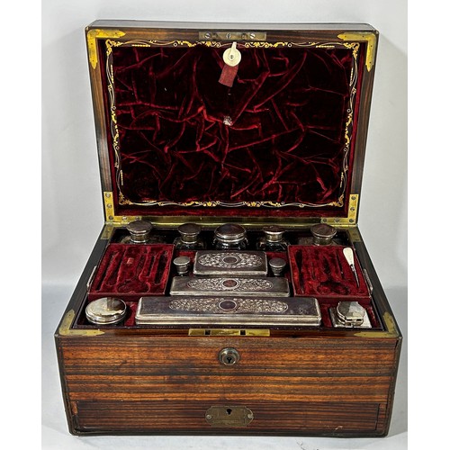 678 - A 19th century Coromandel and brass stringing, Gentleman’s dressing box with red Morocco leather lin... 