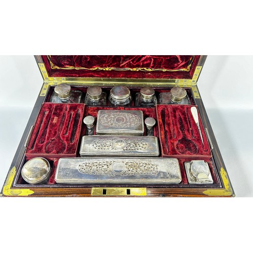 678 - A 19th century Coromandel and brass stringing, Gentleman’s dressing box with red Morocco leather lin... 