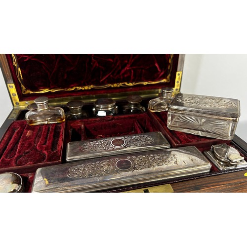 678 - A 19th century Coromandel and brass stringing, Gentleman’s dressing box with red Morocco leather lin... 