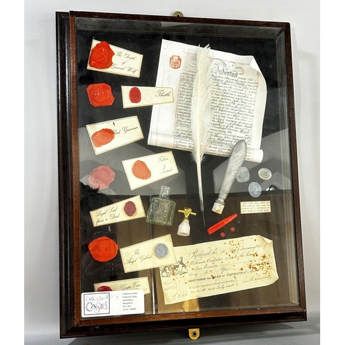 693 - A Collage of writing equipment, parchment and quill, wax seals etc in glazed framed display case, 57... 