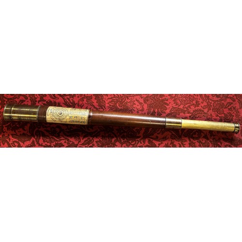 686 - An antique leather bound brass single draw telescope with a cut out panel revealing Naval Signal Fla... 