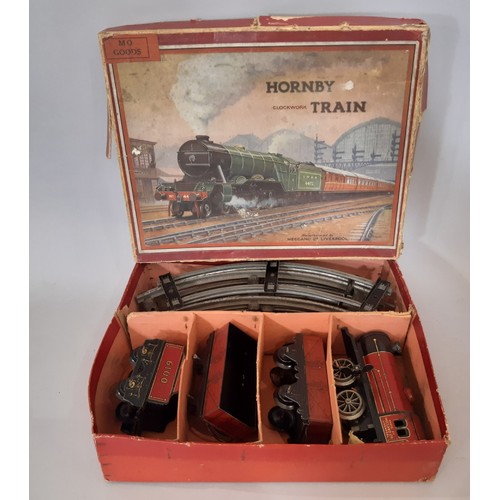 892 - A collection of Hornby 0 gauge railway models including 3 clockwork locomotive train sets, boxed Hor... 