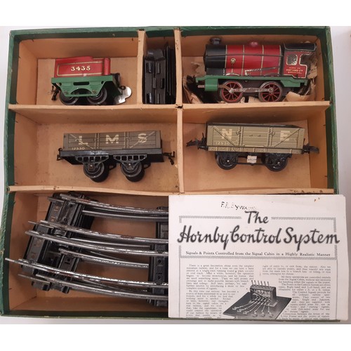 892 - A collection of Hornby 0 gauge railway models including 3 clockwork locomotive train sets, boxed Hor... 