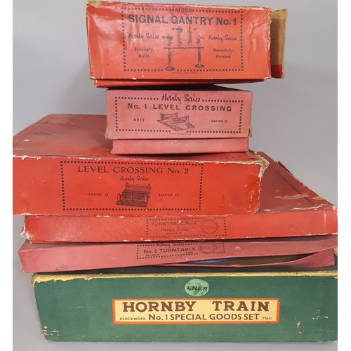 892 - A collection of Hornby 0 gauge railway models including 3 clockwork locomotive train sets, boxed Hor... 