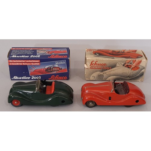 895 - Two clockwork cars by Schuco comprising vintage Examico 4001 with instructions, and Akustico 2002 (r... 