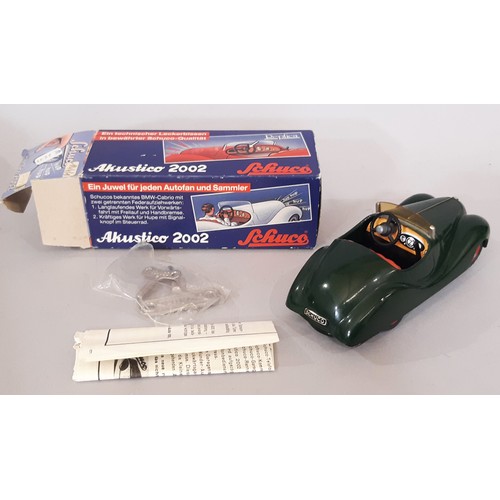 895 - Two clockwork cars by Schuco comprising vintage Examico 4001 with instructions, and Akustico 2002 (r... 