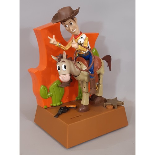 898 - Toy Story 'Talk 'N  Bank' animated money box featuring Woody riding a horse