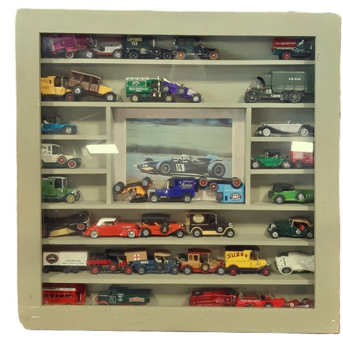 901 - A mixed model vehicles including a wall display cabinet with glazed hinged front filled mainly with ... 