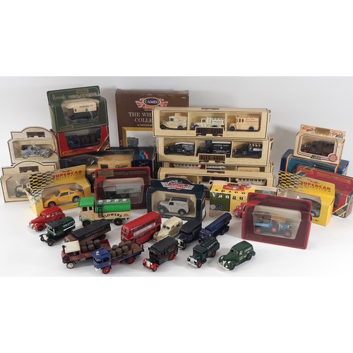 901 - A mixed model vehicles including a wall display cabinet with glazed hinged front filled mainly with ... 