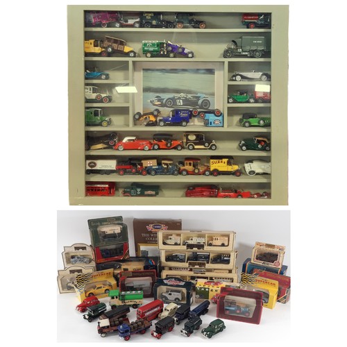 901 - A mixed model vehicles including a wall display cabinet with glazed hinged front filled mainly with ... 