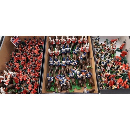 903 - A large collection of painted cast metal model soldiers, guards and cavalry including Yeoman Guards ... 