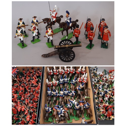 903 - A large collection of painted cast metal model soldiers, guards and cavalry including Yeoman Guards ... 