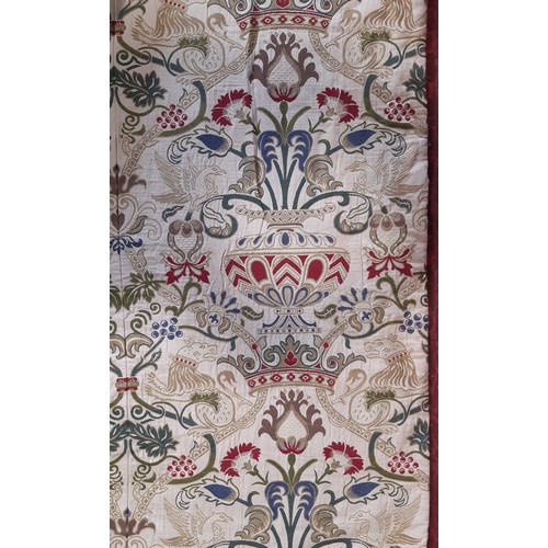 910 - A pair of good quality extra long curtains in a heavy woven brocade type fabric of heraldic and clas... 