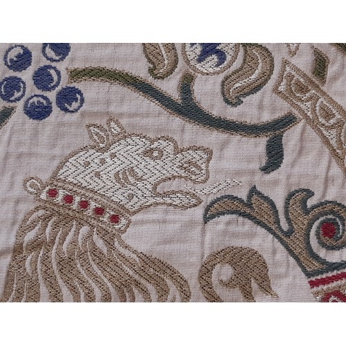 910 - A pair of good quality extra long curtains in a heavy woven brocade type fabric of heraldic and clas... 