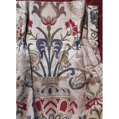 910 - A pair of good quality extra long curtains in a heavy woven brocade type fabric of heraldic and clas... 