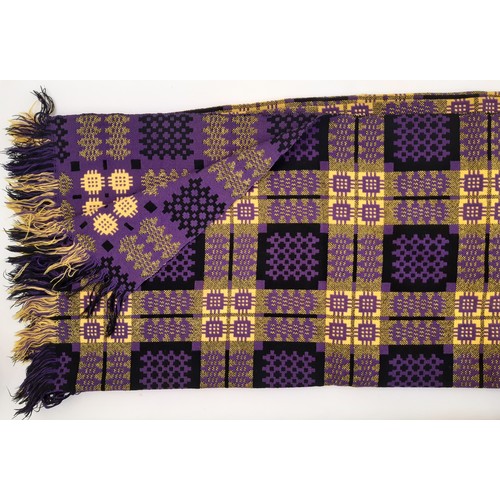 913 - Traditional woollen Welsh blanket in reversible double weave with fringed edges. Colours are purple,... 