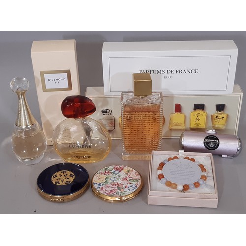 917 - A mixed lot comprising part bottles of perfume including Cinema by Yves Saint Laurent and Givenchy I... 