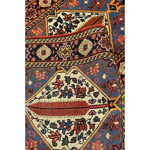 1685 - A Persian runner with alternating diamond medallions and floral borders, 290cm x 85cm approximately