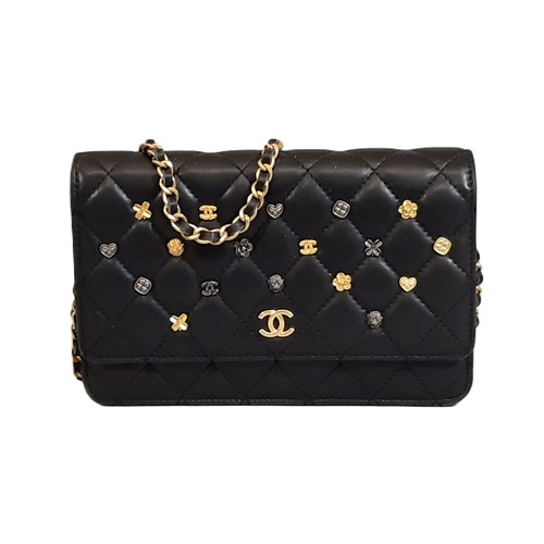 6 - Quilted Charms Wallet by Chanel 2017 in black lambskin with chain and 16 charms on front flap. Inter... 