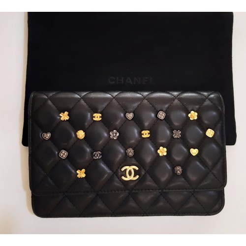 6 - Quilted Charms Wallet by Chanel 2017 in black lambskin with chain and 16 charms on front flap. Inter... 