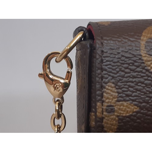 7 - Louis Vuitton Pochette Félicie Bag in Monogram canvas and lined in fuchsia microfibre. The bag is en... 