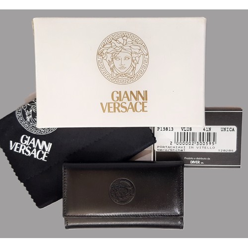 11 - Gianni Versace ladies' wallet/ purse and key purse in black leather, boxed and unused with dust clot... 