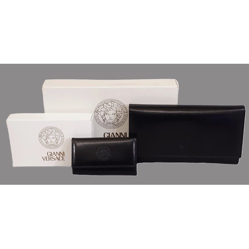 11 - Gianni Versace ladies' wallet/ purse and key purse in black leather, boxed and unused with dust clot... 