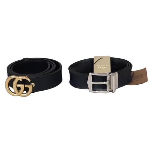 24 - Two Men's 35mm belts comprising a 90 cm belt by Burberry with reversible pin in navy/ black London c... 