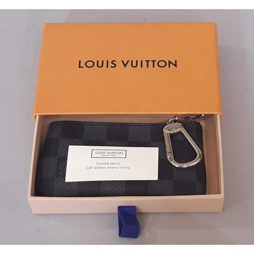 31 - Louis Vuitton key pouch in Damier Graphite canvas with zip closure, leather lining and key ring. 12x... 