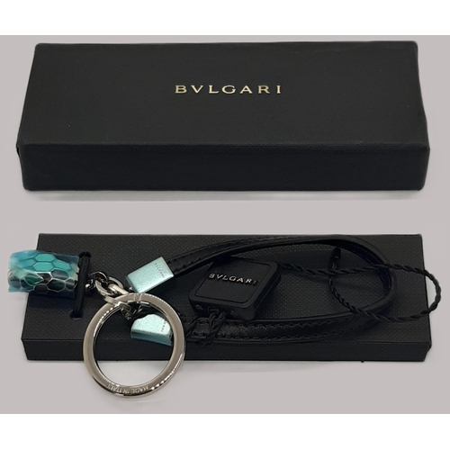 34 - Bulgari Serpenti keyring with snakehead motif fob, leather band and silver hardware. In box, unused,... 