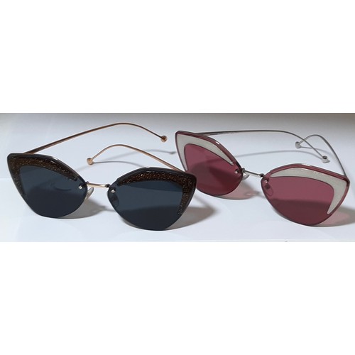 39 - Four pairs of women's sunglasses including two pairs of Cat Eye type by Fendi, one pair by Persol an... 