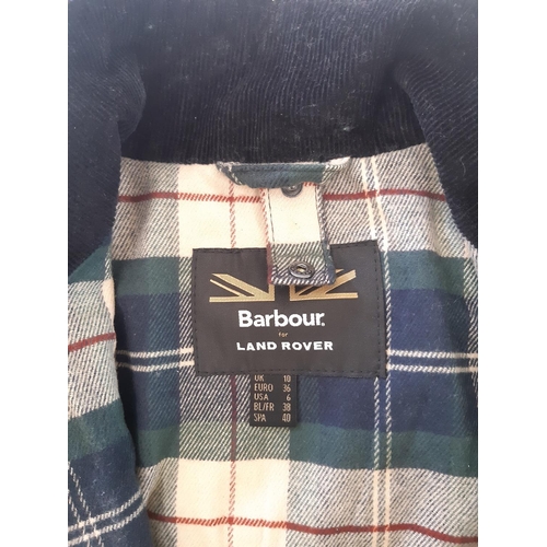 43 - Barbour for Land Rover women's black oilskin jacket with corduroy collar and tartan lining, together... 