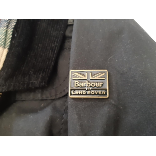 43 - Barbour for Land Rover women's black oilskin jacket with corduroy collar and tartan lining, together... 