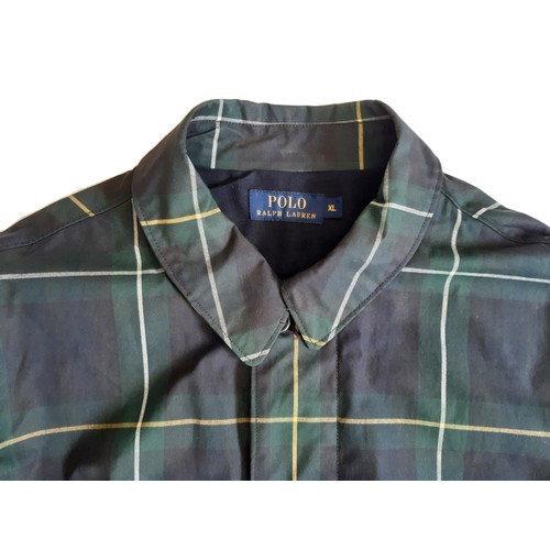 45 - Ralph Lauren Polo water-proof jacket in checked oil cloth with zipped and buttoned front, 2 large po... 