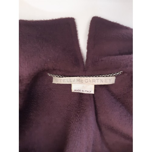 57 - Full length coat by Stella McCartney in mulberry coloured cashmere, with single button closure, back... 