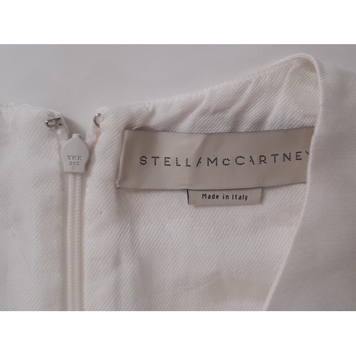 58 - Short sleeved shift dress by Stella McCartney in white with coloured stone embellishments. No size l... 