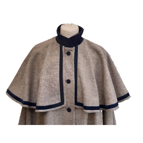 60 - Laura Ashley woollen tweed cape in a twill weave with navy velvet collar, buttons and trim. One size... 