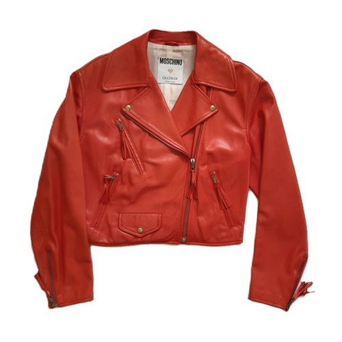 61 - Red leather women's jacket by Moschino with embroidered  writing verso, size 12